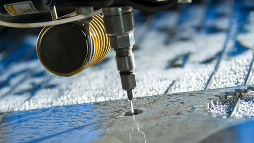 How do you prevent parts from lifting or shifting during waterjet cutting?
